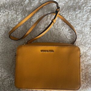 Yellow Michael Kors crossbody purse